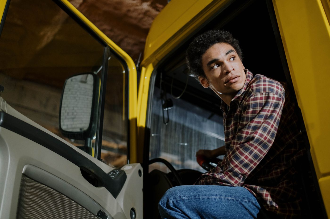 A lorry driver seated in the cab